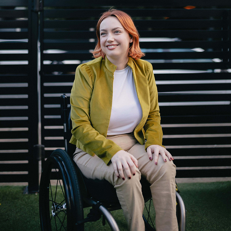 Elly Desmarchelier sitting outdoors