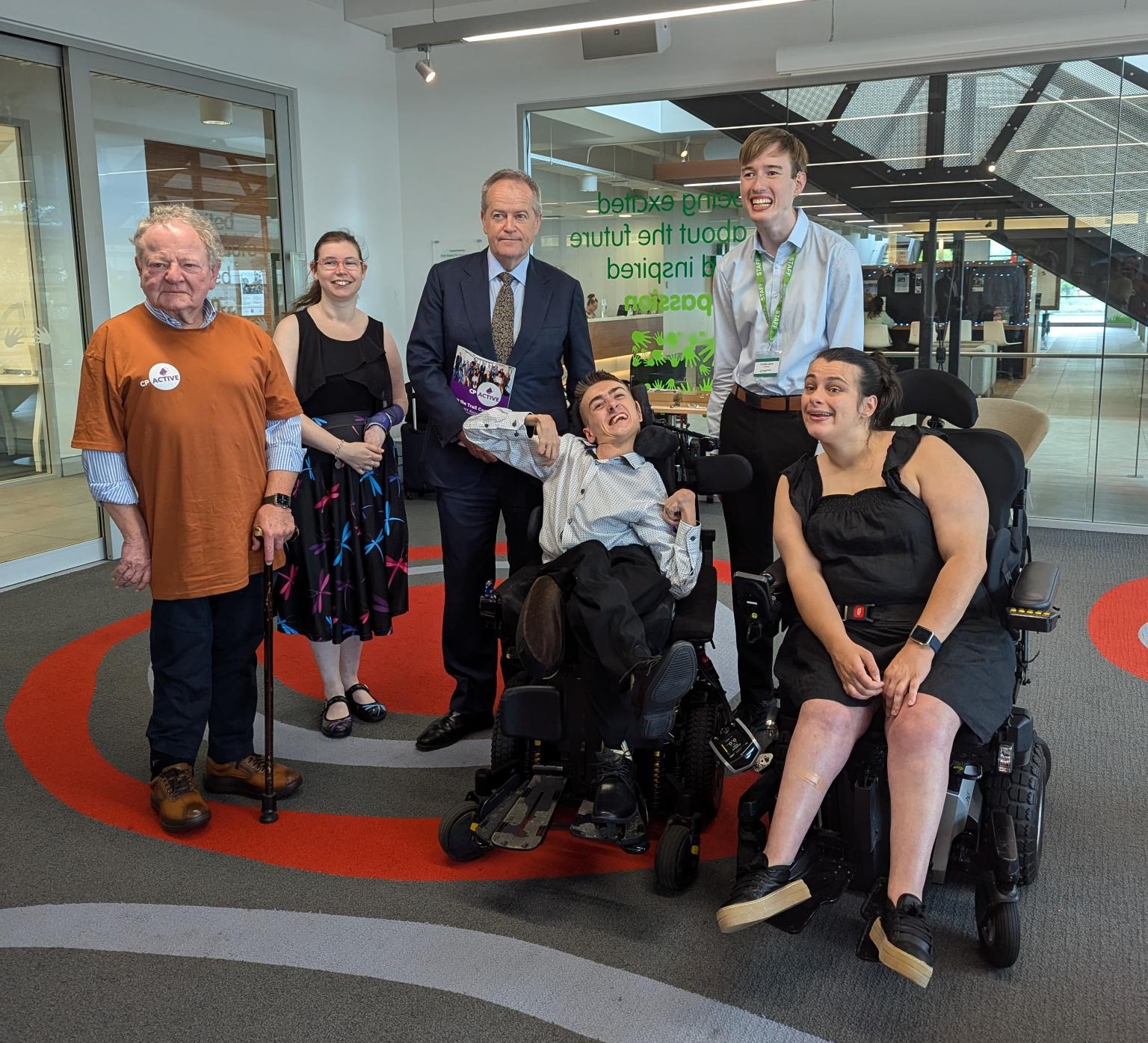 From left to right: Andrew Buchanan, Saranna Schultz, Minister Bill Shorten, Riley Saban, Nicholas Lapsley and Sophie Geeves at the Cerebral Palsy office in Allambie.