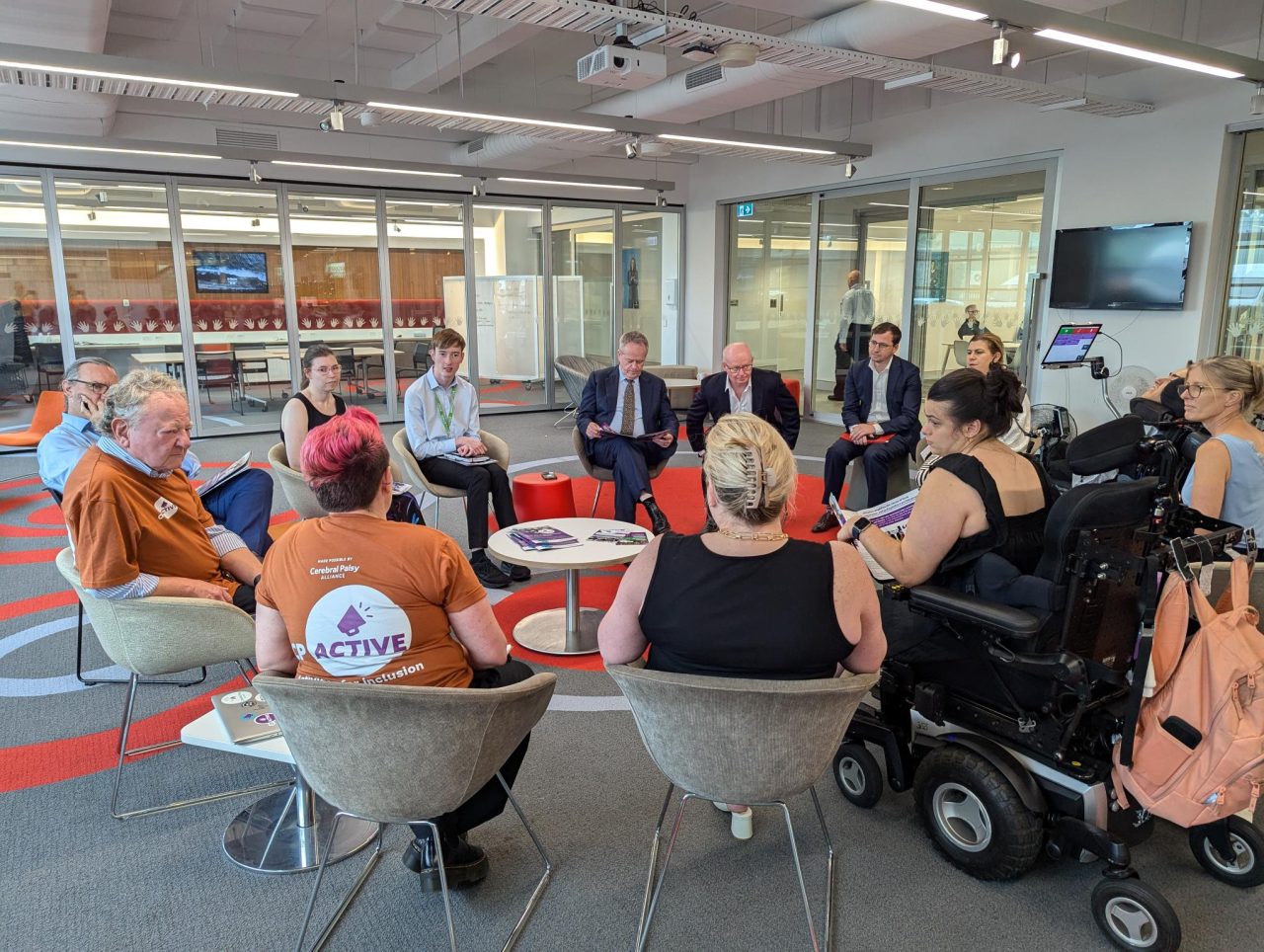 CPActive Champions, Cerebral Palsy Alliance staff, and others sit in a circle with Minister Bill Shorten to discuss 